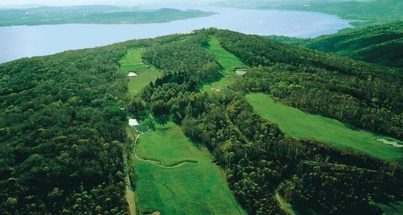 Panoramic view of a championship golf course overlooking the Italian Lakes